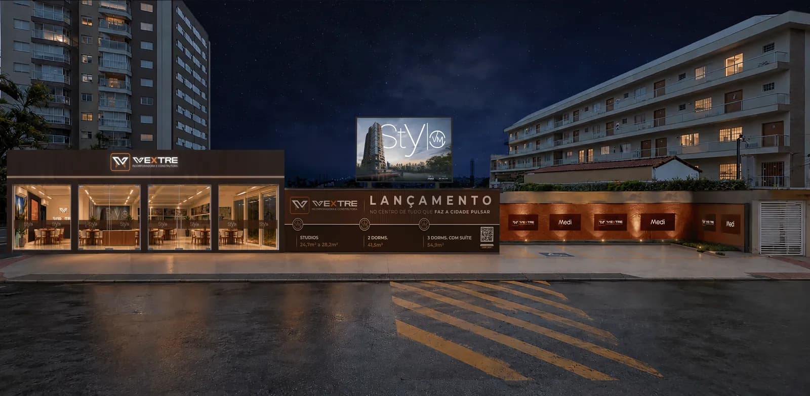 O stand à noite — Tapume com o KV do lançamento